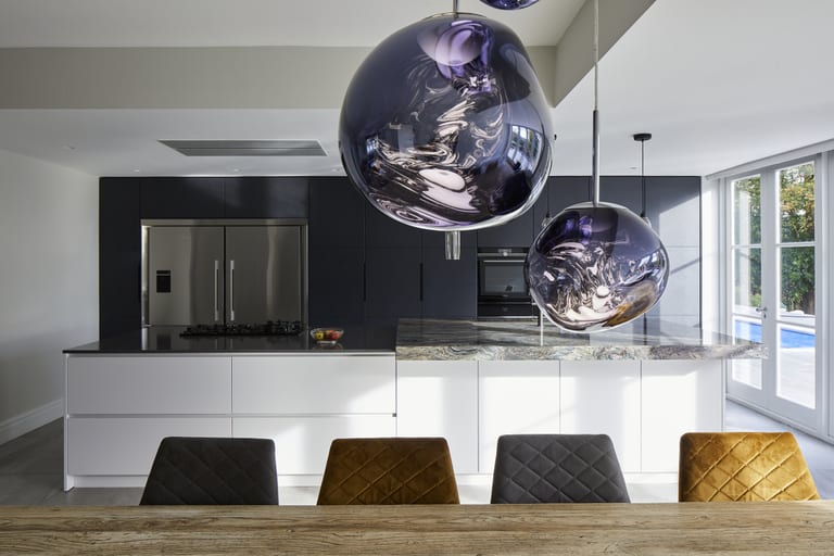 Herringbone ash and lacquered cabinetry with Compac surfaces and Fusion Wow quartzite in a Bidborough kitchen.