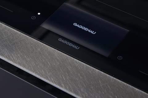 A Gaggenau hob and controls set into the stainless steel worktop in the Hammersmith kitchen project.