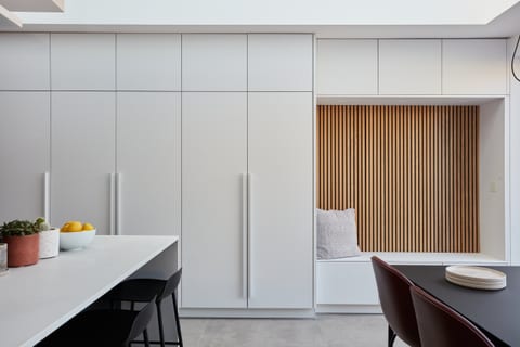 Super-matt white and anthracite cabinetry with Sense and Silestone worksurfaces in a Crystal Palace kitchen.