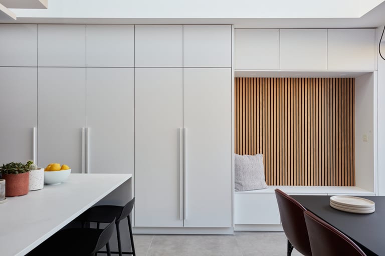 Super-matt white and anthracite cabinetry with Sense and Silestone worksurfaces in a Crystal Palace kitchen.