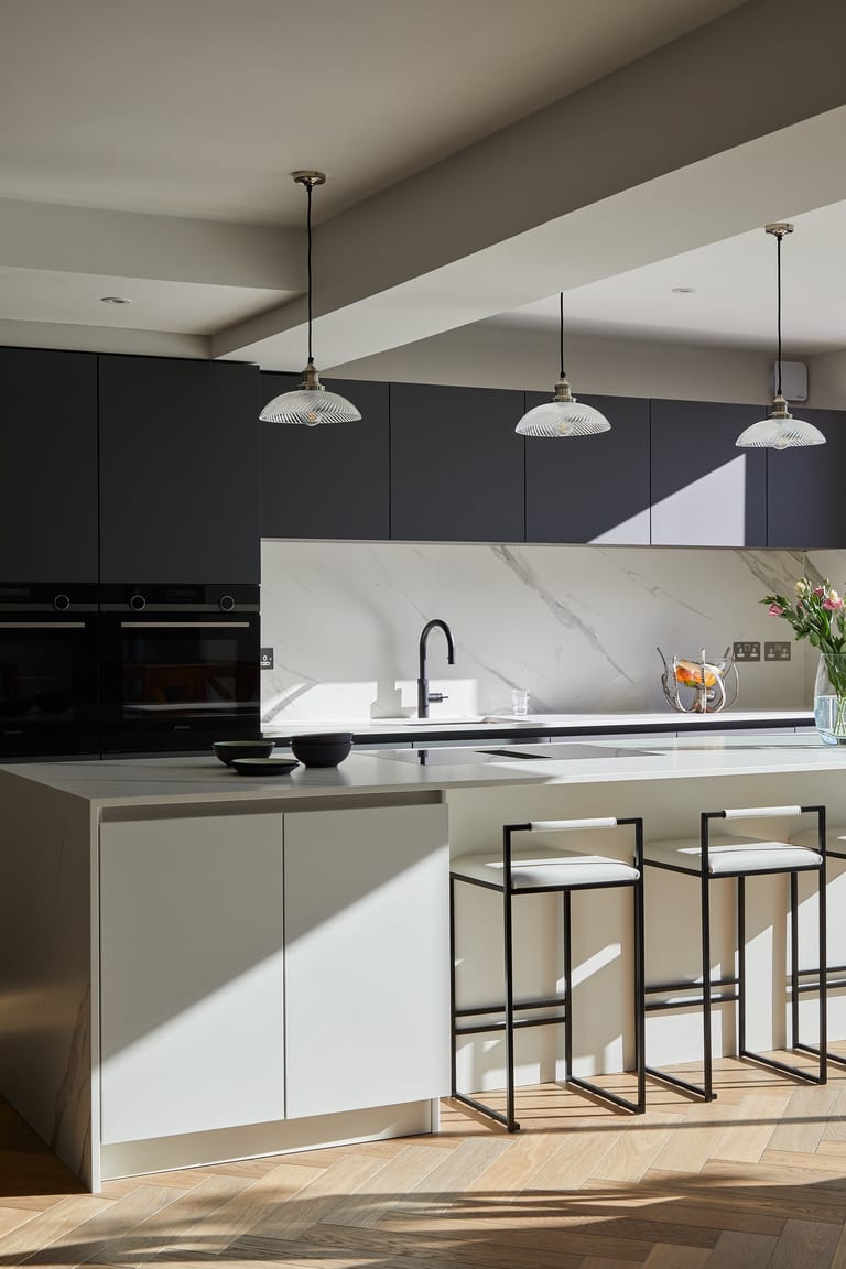 Super-matt white and anthracite cabinetry with a Dekton worksurface in a Bromley kitchen.