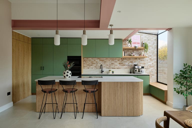 Special-colour lacquer cabinetry with oak detailing and a reeded-oak island in a West Wickham kitchen.